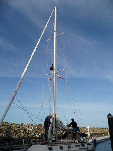 and hoists her burgee.